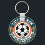 Soccer Mom Cheering Loving Key Ring<br><div class="desc">For soccer moms who bring energy and heart to every match, this metal circle keychain blends everyday function with proud sideline style. The design features SOCCER MOM around a bold soccer ball, with a whistle icon and the phrase CHEERING HARD • LOVING HARD in a bright teal, coral, and gold...</div>