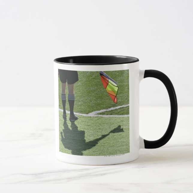 Soccer referee holding flag. mug (Right)