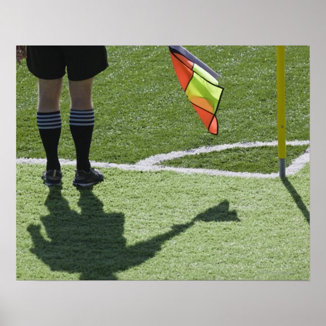 Soccer referee holding flag. poster (Front)