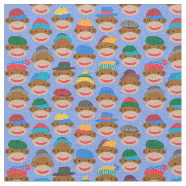 Sock Monkey Heads with caps on Blue Fabric (Close Up)