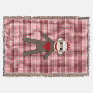 sock monkey woven blanket on red pattern