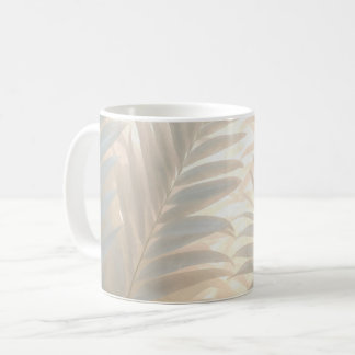Soft gold of white tropics, pastel palm leaves coffee mug