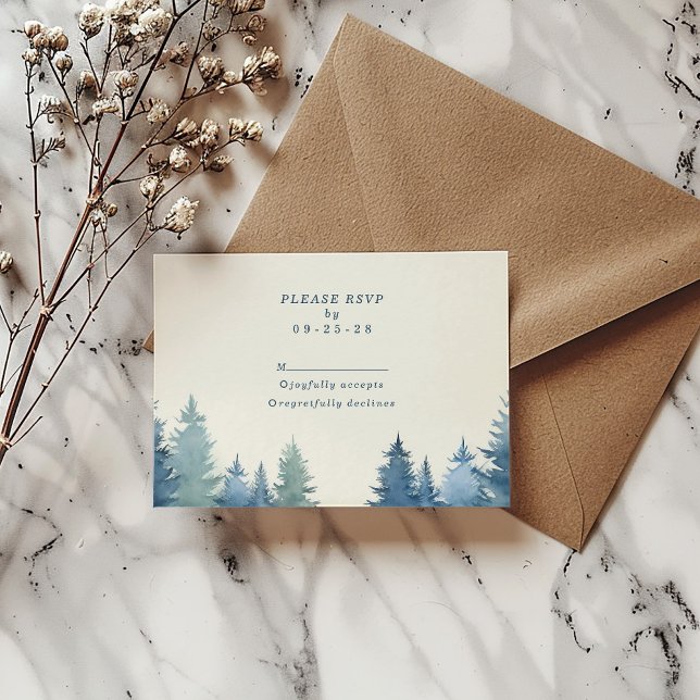 Soft pine trees green wedding rsvp (Soft pine trees wedding rsvp response card on top of a brown envelope.)