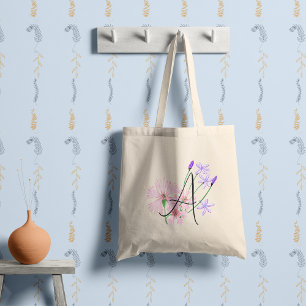 Soft pink and lilac wildflowers with your initial. tote bag