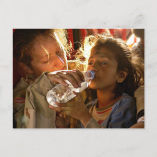 Soldier Helping a Refugee Child Postcard