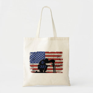 Soldier kneeling silhouette and American flag Tote Bag