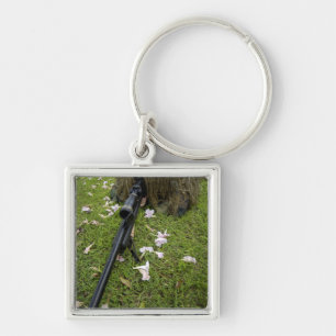 Soldier practices sniper tactics key ring