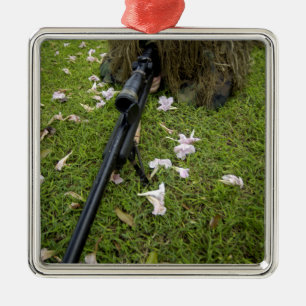 Soldier practices sniper tactics metal tree decoration