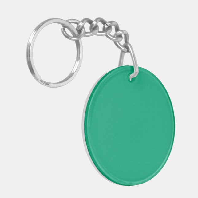Solid teal background with a smooth texture key ring (Front Left)
