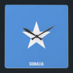 Somalia Flag Dazzling Patriotic Square Wall Clock<br><div class="desc">Somalia Flag Dazzling Patriotic Square Wall Clock in the colours and the elements of the Somalia national flag covering the front of the clock. National flag colours are complemented with the text "Somalia" on the bottom. Text is fully customisable using "Customise it!" feature. Feel free to change it, remove it...</div>
