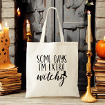 Some Days I'm Extra Witchy Modern Womens Halloween Tote Bag<br><div class="desc">Add a touch of sass to your style with our "Some Days I'm Extra Witchy" Modern Women's Halloween Tote Bag! This chic black tote features the playful phrase in elegant, modern typography, perfect for expressing your witchy side. Made from durable materials, it’s spacious enough for all your daily essentials, whether...</div>