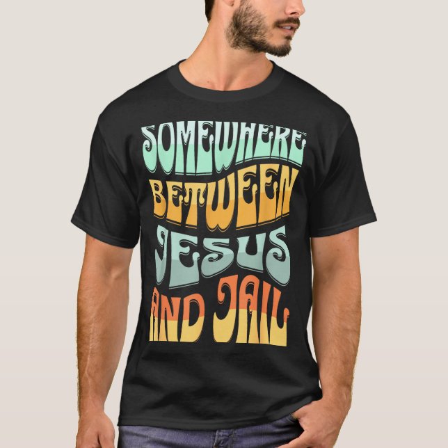 Somewhere Between Jesus And Jail Funny Christian Q T-Shirt (Front)