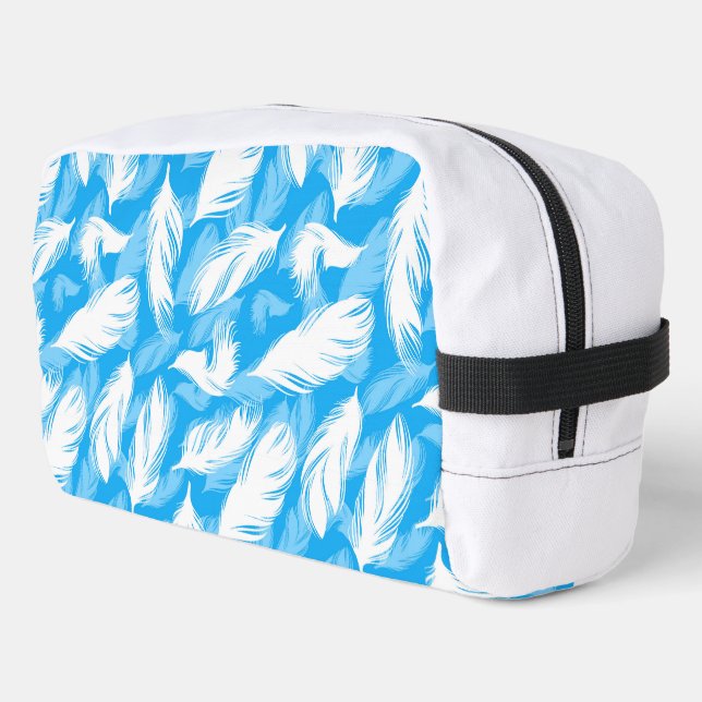 Sophisticated Feather Design On A Bright Blue  Dopp Kit (Left Corner)