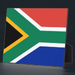 South African Flag Plaque<br><div class="desc">Add a touch of South African pride to your decor with our exclusive plaque featuring the flag of South Africa! Crafted with meticulous attention to detail, this plaque is not just a decorative item; it’s a celebration of South Africa’s vibrant culture and heritage. The stylish design prominently displays the iconic...</div>