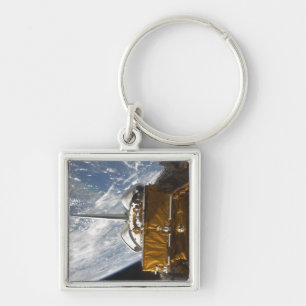 Space Shuttle Atlantis' payload bay backdropped Key Ring