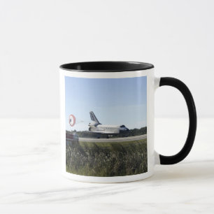 Space shuttle Atlantis unfurls its drag chute Mug