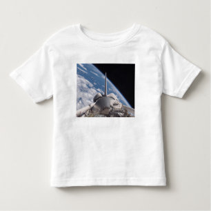 Space Shuttle Discovery backdropped by Earth Toddler T-Shirt