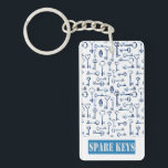 Spare Keys Key Ring<br><div class="desc">Spare Keys Tag,  especially for your spare key or to be used "In Case of Emergency." Design has lots of navy-blue skeleton keys. Great idea to give a spare key to a neighbour in case you get locked out. This product is customisable.</div>