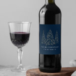 Sparkling Winter Pine Navy Merry Christmas Wine Label<br><div class="desc">Add a festive touch to your wine bottles this holiday season with custom holiday wine labels. The holiday wine labels feature snowy faux gold foil pine trees with a navy background (or colour of your choice). "Merry Christmas" is displayed in a white, modern serif font with your name or custom...</div>