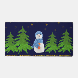 Sparkly gold stars, snowman and green tree on blue desk mat