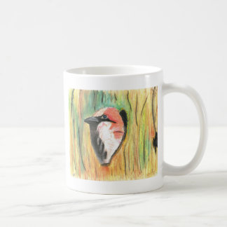 sparrow peaking from a piling coffee mug