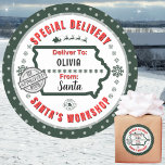 Special Delivery from Santa to Child in Iowa Green Classic Round Sticker<br><div class="desc">For the kids in IOWA!! Make your Christmas gifts stand out with these fun colourful & personalised sticker labels. The design features a Special Delivery theme from Santa's Workshop at the North Pole; complete with an approval stamp from elf #25. Vibrant deep greens along with snowflakes, Santa's sleigh and reindeer...</div>
