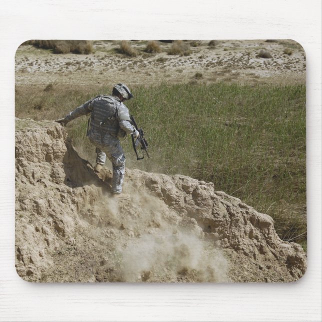 Specialist climbs down mouse pad (Front)