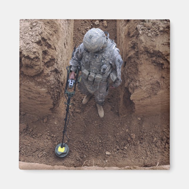 Specialist searches for a weapons cache magnet (Front)