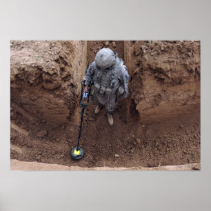 Specialist searches for a weapons cache poster