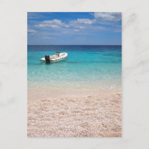 Speedboat in the blue sea postcard