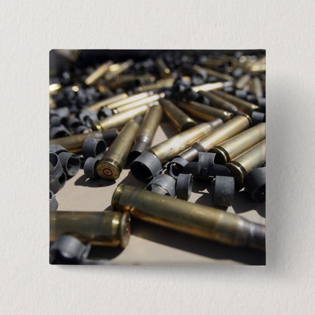 Spent brass and disintegrated links 15 cm square badge (Front)