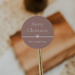 Spice | Modern Bow Simple Minimal Christmas Classic Round Sticker<br><div class="desc">Finish your holiday mailings and gifts with these sweet and simple Christmas stickers,  customisable with your preferred holiday greeting and family signature (shown with "Merry Christmas") on a soft earth tone terracotta background. A petite bow running through the centre completes this elegant minimalist holiday design.</div>