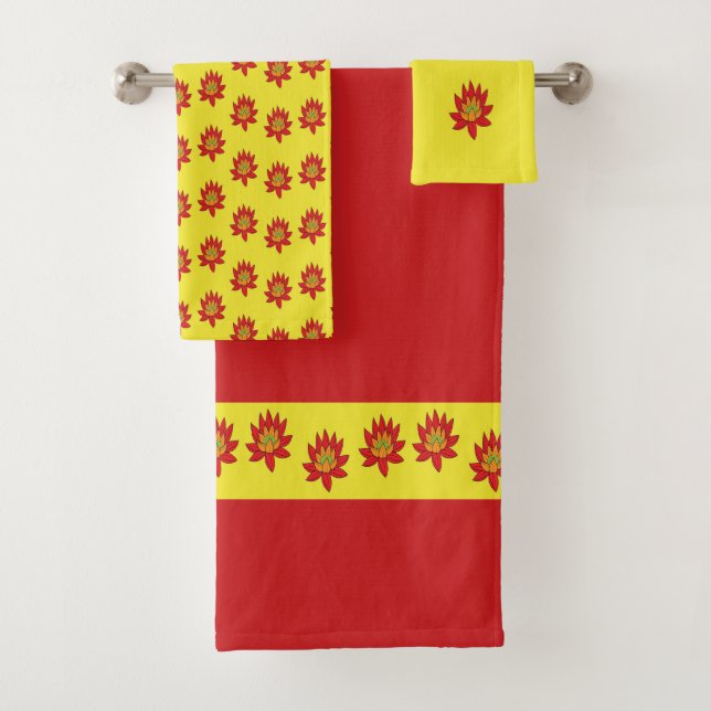 Spiky orange and red flower on yellow bath towel set (Insitu)