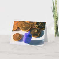 Spinning Dreidel with Gelt (chocolate coins)