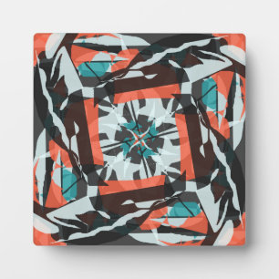 Spinning Tile Design in Orange, Black, and Aqua Plaque