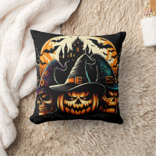 Spooky pumpkin display with witches and a castle cushion