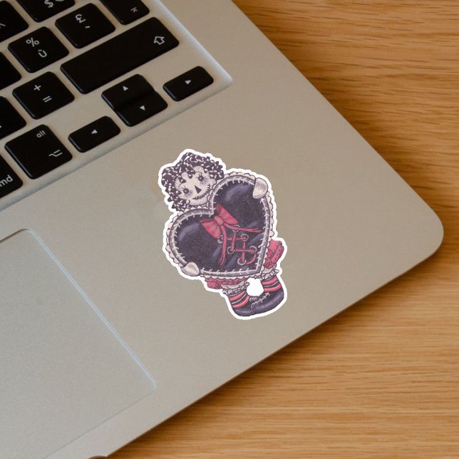 Spooky Rag Doll Yarn Hair Big Black Heart Red Bow (Spooky rag doll pale face black yarn look hair with black heart red bow on vinyl sticker.)