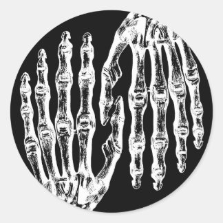 Spooky skeletal hands classic round sticker