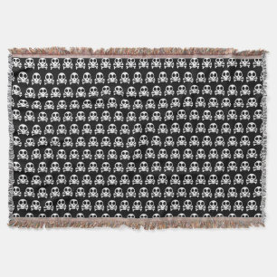 spooky skull on a black background throw blanket