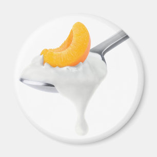 Spoon of peach or apricot yogurt magnet