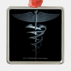 Spotlight on a medical caduceus metal tree decoration