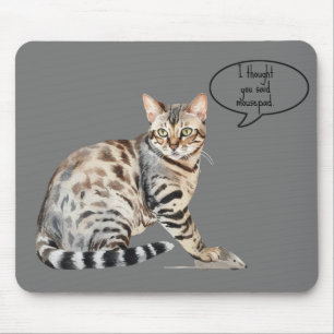 Spotted Bengal Cat with Mouse on a Mouse Pad