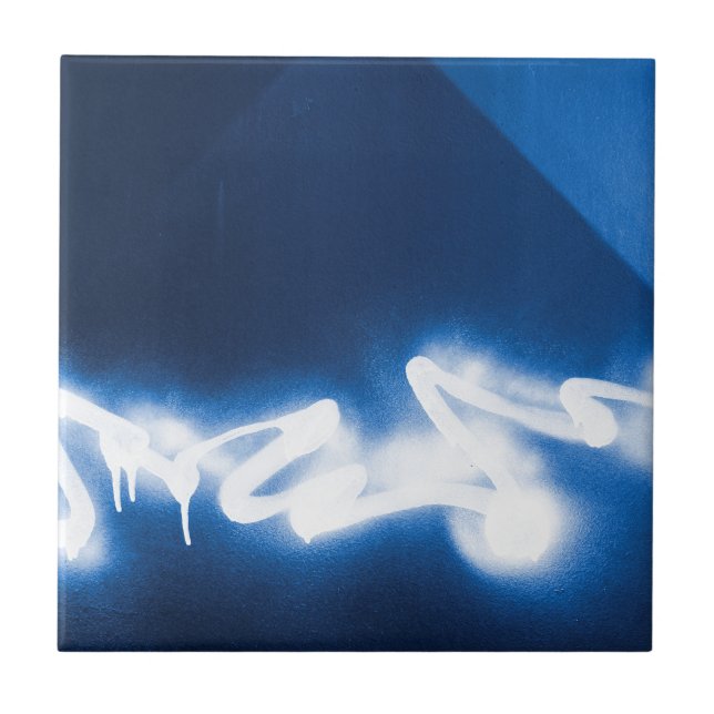 Sprayed graffiti on blue metal ceramic tile (Front)