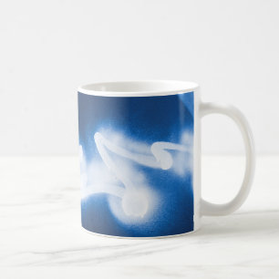 Sprayed graffiti on blue metal coffee mug