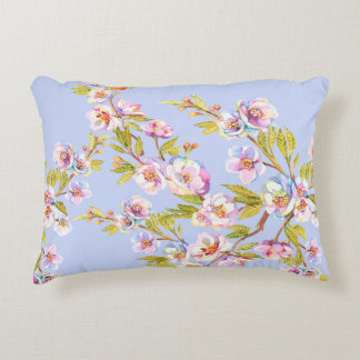 Sprigs of flowering apple or cherry trees on the b decorative cushion