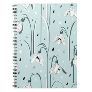 Spring background with delicate snowdrop flowers a notebook