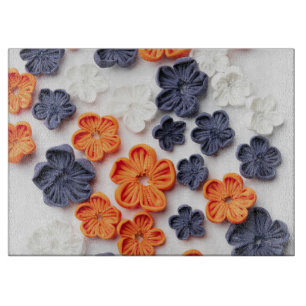 Spring handmade sewn fabric flowers orange blue  cutting board