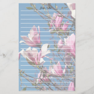 spring pink magnolia flowers in blue sky stationery
