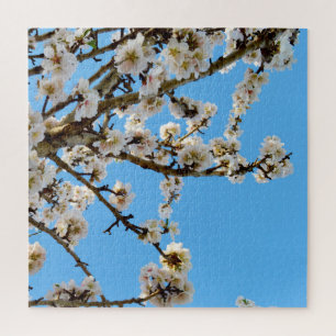 Spring's Embrace: White Blossoms Against Blue Sky Jigsaw Puzzle