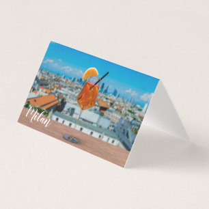 Spritz cocktail on a table with view of Milan